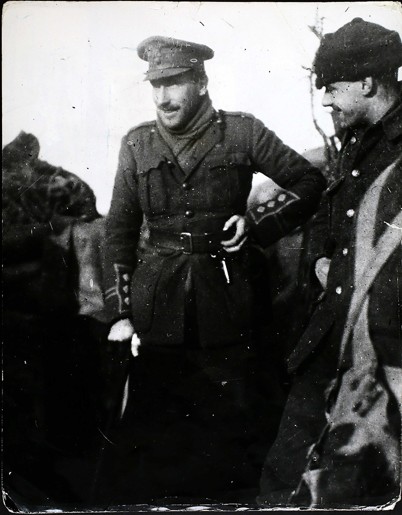 A Company Commander of the Royal Fusiliers visiting one of his forward posts in Flanders