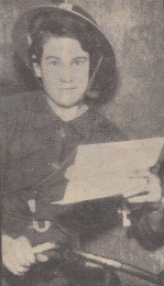 The image shows Charity Bick in her Civil Defence Despatch Rider's uniform, wearing a tin helmet at an angle. The handlebars of her bicycle are visible. Charity is holding a letter from the Regional Commissioner for the Midlands, congratulating her for her bravery. Women played a crucial role in the war effort during WWII, on the home front and overseas. Charity's act of bravery during the Blitz is one of a number of inspiring women's stories from the home front during WWII. © Newspapers.com