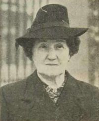 Margaret Cangley of the Merchant Navy. The image shows Margaret in civilian clothing, wearing a black coat and hat. Her tale of bravery at sea was one of many inspiring women's stories from WWII. Publisher: The Amalgamated Press Ltd.