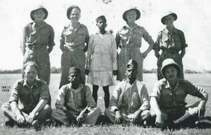 Group photo of British soldiers. John Merritt Wentworth is seated on the far left. Some of the men are in shorts and warm weather gear, complete with pith helmets. Image provided by Rob P. 